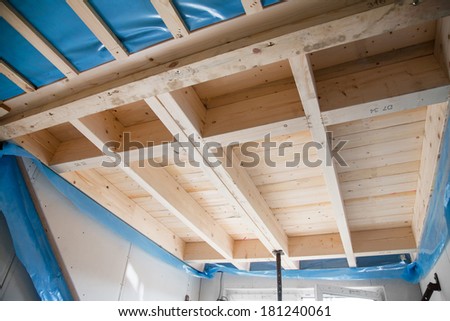 Heat isolation in a new prefabricated house with mineral wool and wood.