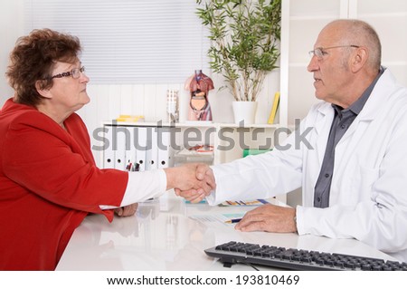 Appointment at doctor: older woman talking with a specialist.