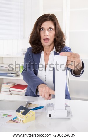 Shocked and frustrated business woman controlling expenses.