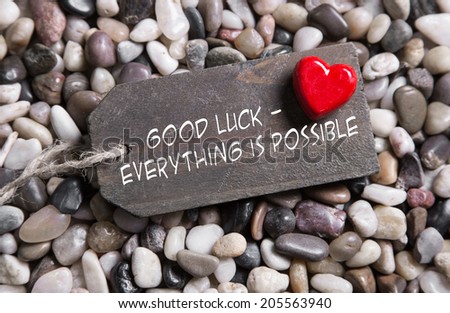 Good luck and everything is possible: greeting card with red heart for courage and convalescence.