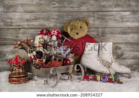 Old children toys on wooden background for christmas decoration.