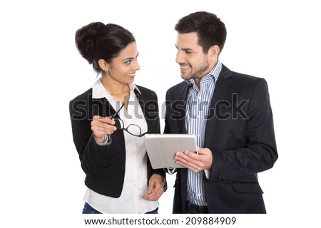 Successful young business team. Man and woman isolated over white with tablet.