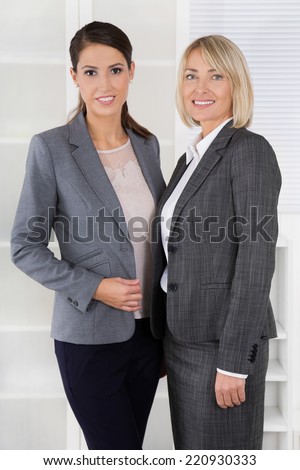 Team Portrait: Successful business woman making career in management positions.