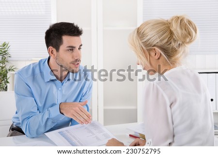 Professional business meeting: consultant explain his female customer the risc and possibilities of provision for one\'s old age.