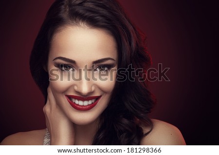 Portrait of beautiful brunette with beautiful hairstyle and a smile on his face