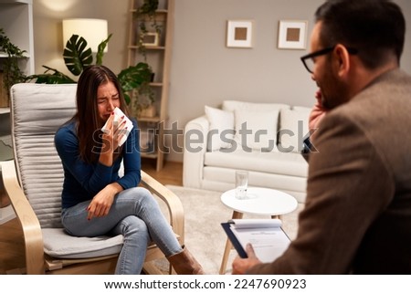 Young woman cries during therapy with a psychologist Stockfoto © 