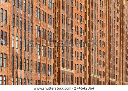New York City wall of apartment building windows background texture