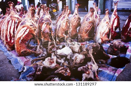 Raw meat of various animals at a street stall in Tibet