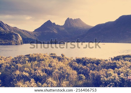 Cradle Mountain, an iconic Australian landscape in glowing sunset light with Instagram style filter