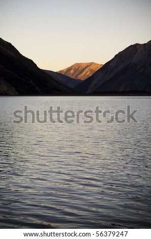 Lake with sunset-lit mountain in New Zealand