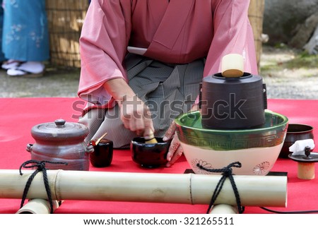 KAGAWA, JAPAN - SEPTEMBER 23, 2015: Japanese man in traditional kimono prepares the tea ceremony at garden of the Hagiwara Temple on September 23, 2015 in Kagawa Japan.