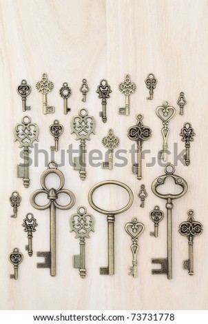 Old keys wooden background