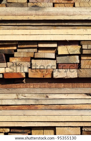 stack of wood planks on lumber yard