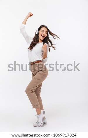 Similar – Image, Stock Photo Cheerful women dancing while listening to music