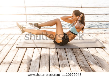 Similar – Image, Stock Photo Sportswoman lying on sports ground near basketball