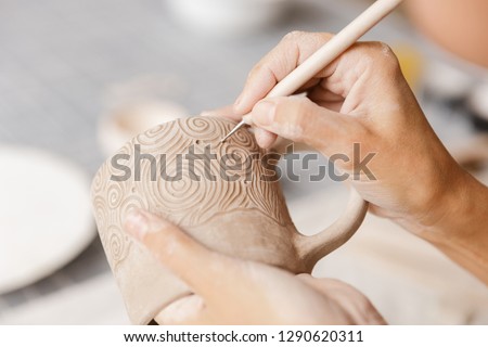 Similar – Image, Stock Photo Woman making ceramic work with potter’s wheel