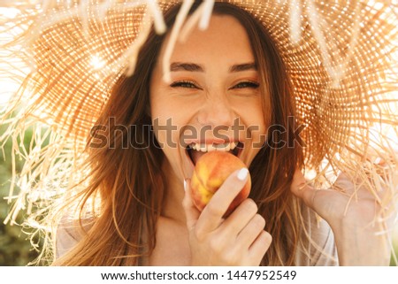 Similar – Image, Stock Photo Beautiful woman with peach standing in modern kitchen