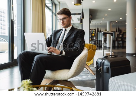 Similar – Image, Stock Photo Stylish businessman with suitcase in city