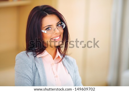 Young beautiful businesswoman in glasses