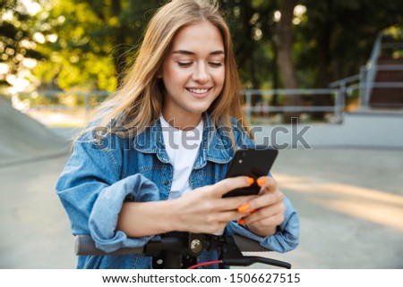 Similar – Image, Stock Photo Stylish teenagers using smartphone outdoors