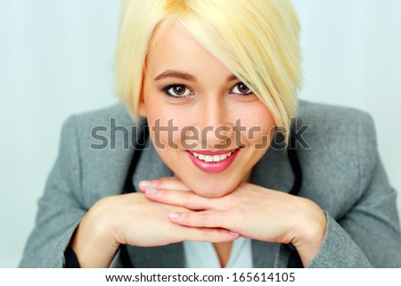 Closeup portrait of a happy businesswoman isolated on a white background