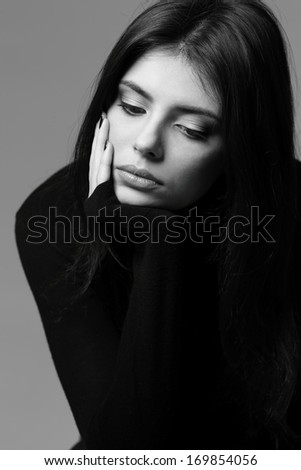 Black and white closeup portrait of a nervous woman