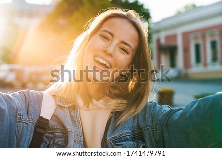 Similar – Image, Stock Photo Blonde woman wearing denim shirt and black leather skirt sitting in an urban bench.