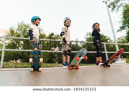 Similar – Foto Bild Kind mit Skateboard und Sonnenbrille macht Rocksymbol mit erhobenen Händen