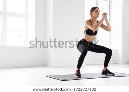 Similar – Image, Stock Photo Focused young sportswoman doing exercise with weight at home