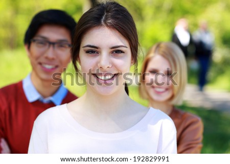 Cheerful group of students in park