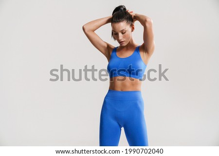 Similar – Image, Stock Photo Young woman with fit body doing muscle stretches