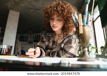 Similar – Image, Stock Photo Woman drawing with pencil in workshop