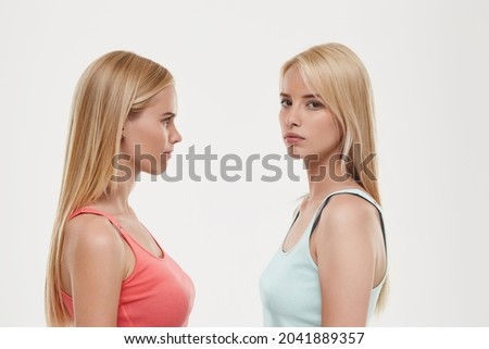 Similar – Image, Stock Photo Two teenager girls standing and looking at their smartphone