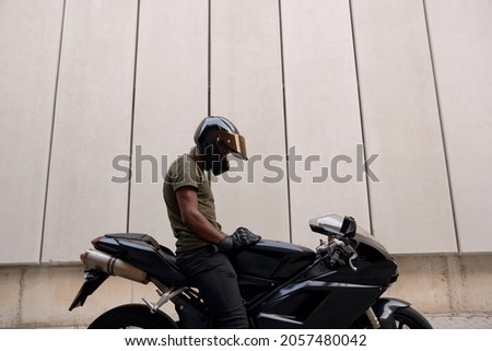 Similar – Image, Stock Photo Man sitting on motorcycle and surfing mobile