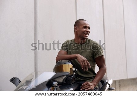 Similar – Image, Stock Photo Man sitting on motorcycle and surfing mobile