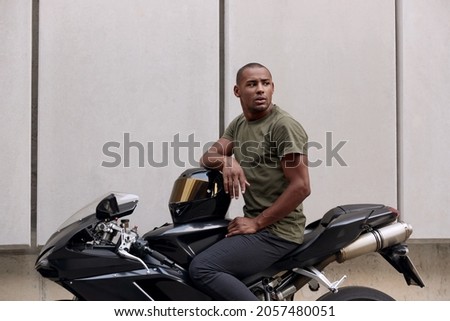 Similar – Image, Stock Photo Man sitting on motorcycle and surfing mobile