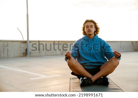 Similar – Image, Stock Photo Blond man practicing meditation at home