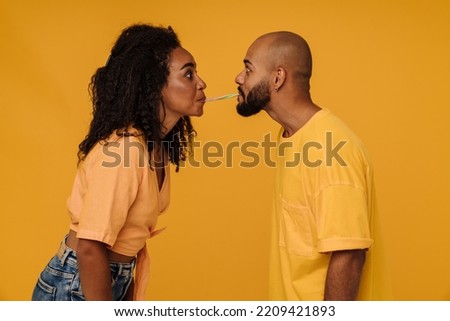 Image, Stock Photo Black woman eating candy