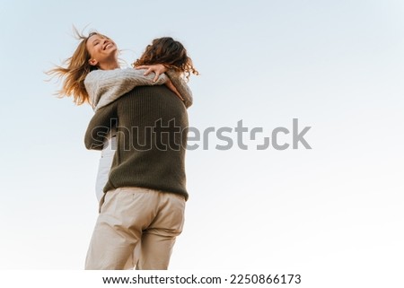 Similar – Image, Stock Photo Loving man and woman supporting each other while standing back to back