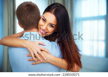 Portrait of a happiness woman hugging his boyfriend at home