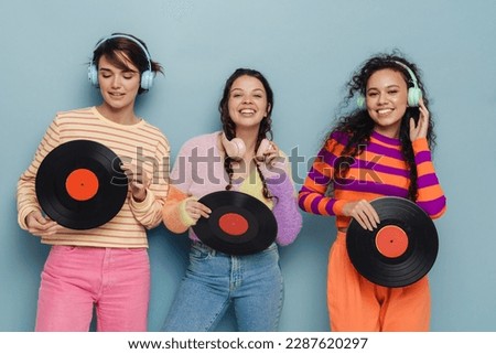 Similar – Image, Stock Photo Woman holding vinyl record. Music passion. Listening to music from analog record. Playing music from analog disk. Enjoying music from old collection. Retro and vintage. Stereo audio. Analog sound