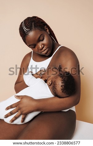 Similar – Image, Stock Photo Mother breastfeeding and hugging her baby boy outdoors