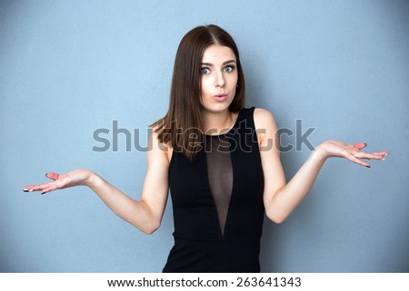 Beautiful young woman with facial expression of surprise