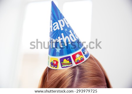 Closeup portrait of a female head with party hat