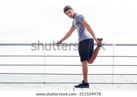 Similar – Image, Stock Photo Man in sportswear resting at stadium seat and use smartphone