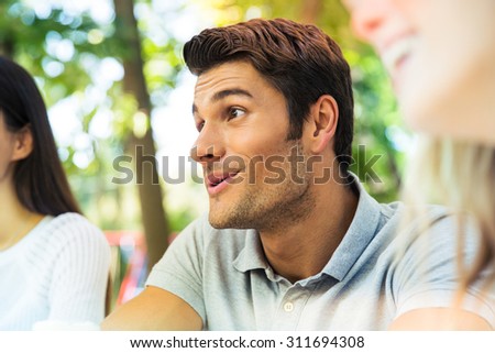 Portrait of a happy friends in outdoors restaurant
