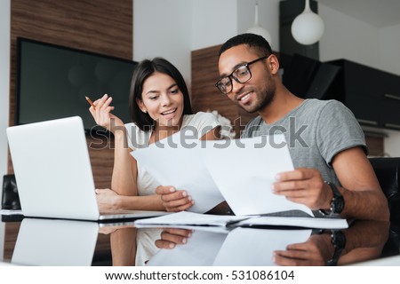 Similar – Image, Stock Photo Young happy couple staying at home with their baby son sitting on the living room floor.
