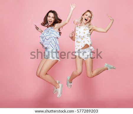 Similar – Image, Stock Photo Two young girls listening to good music while driving in car, enjoy summer road trip in nature.