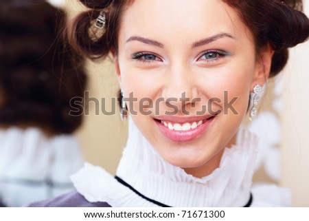 Portrait of a beautiful young happy lady. Retro style
