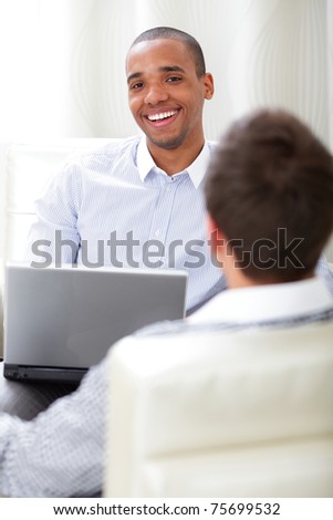 two happy business men having conversation